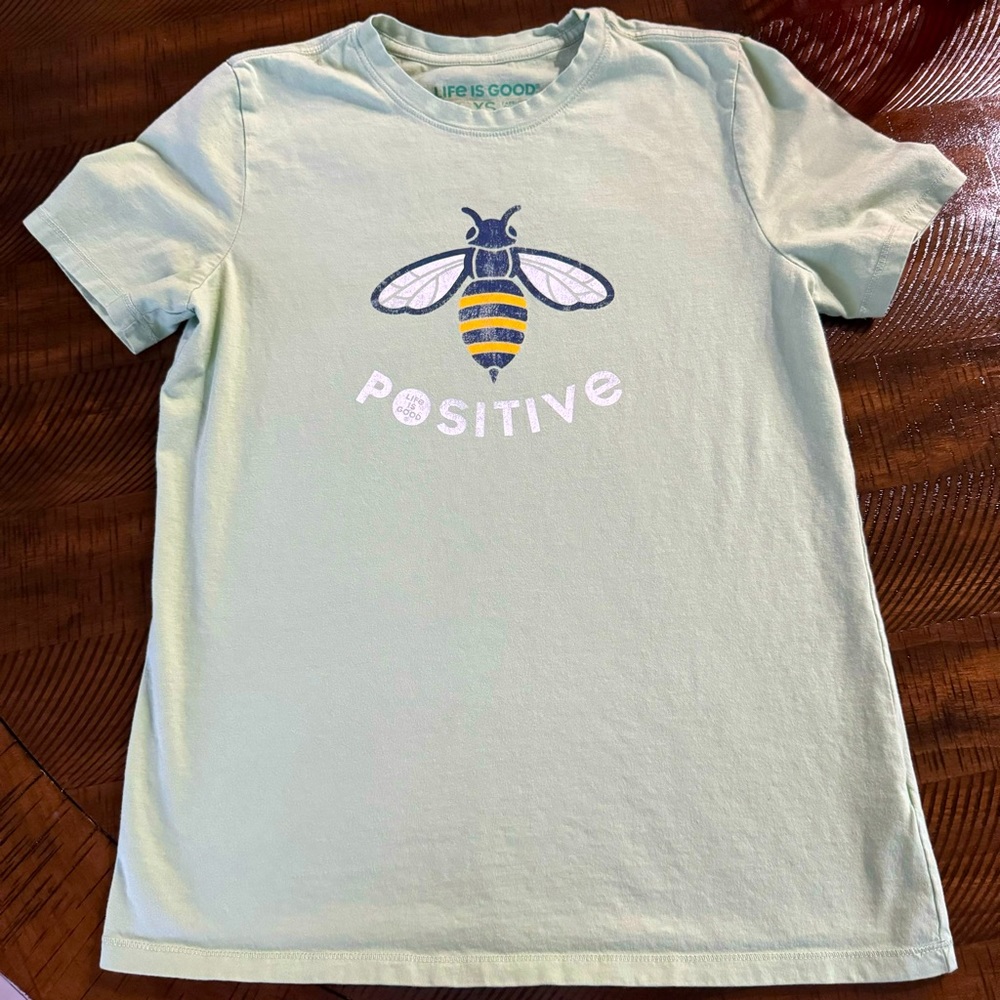 Bee Positive Life is good green tee. Like new